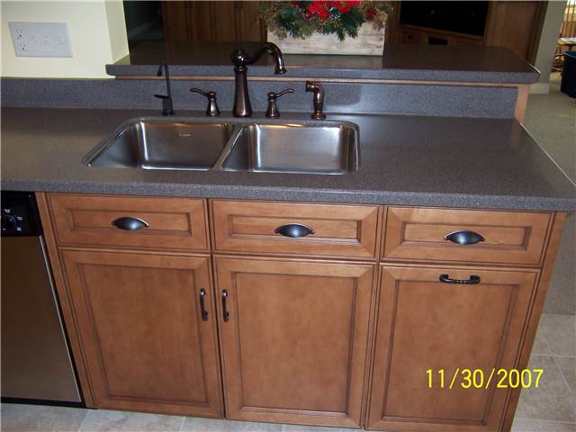Corian solid surface countertop with a stainless undermount sink